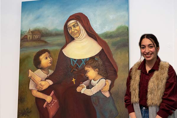 Mary MacKillop College Wakeley student Damyana Moma with her Clancy Prize artwork, The Spirit of Joy