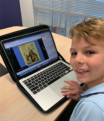Year 2 student, Charles, with his favourite Mary picture.