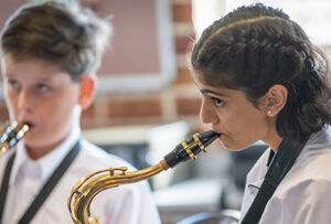 Trinity College Auburn Regents Park students playing instruments during Amadeus Music Program lessons