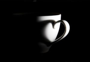 Image of a cup with a love heart shadow