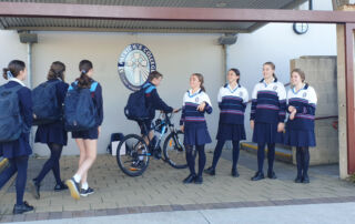 St Patrick's College students are greeted by their student leaders at the school gate on Feel Good Fridays