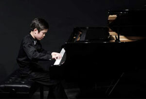 Isaiah Cheng from St Raphaels Hurstville, on a Piano