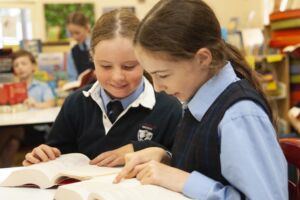 Students read as part of a literature enrichment program at St Charles' Catholic Primary School Waverley.