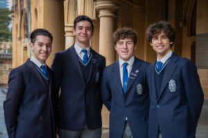 St Mary's Cathedral College year 12 students and choir scholars (from left) Marciano Flammia, Antonio Guarino, Reilly Bashall, and Dylan Ford. Photo - Kitty Beale