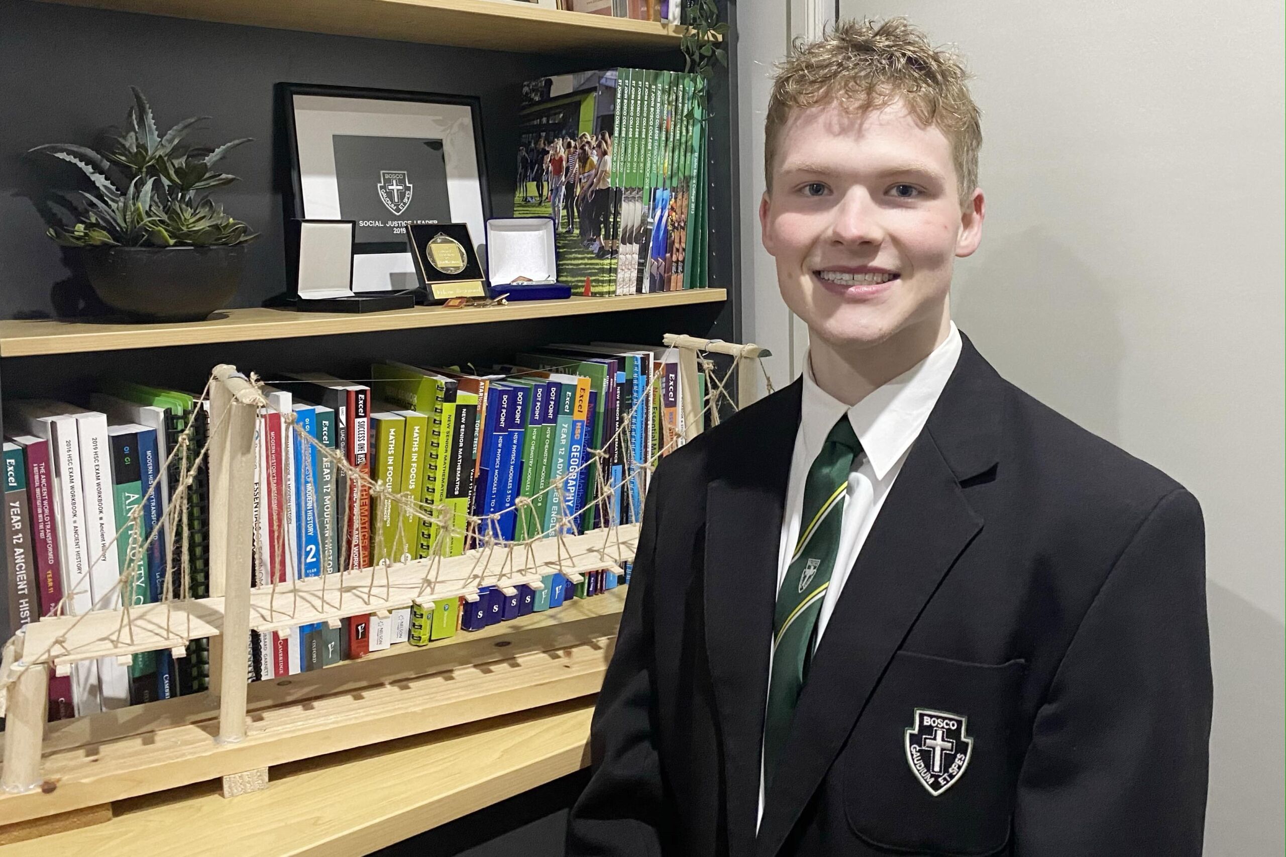 Hayden Westwood with the bridge experiment that won him a 2021 STANSW Young Scientist Award.