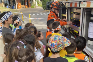 NSW SES volunteers speak to students at St Mary's Catholic Primary School Georges Hall's flood appeal event.