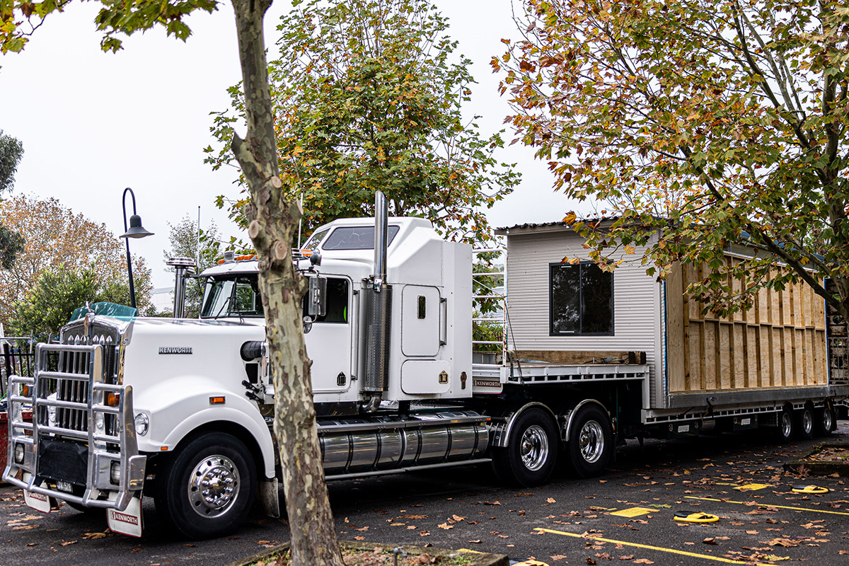 Demountable classrooms are transported from St Patrick's College Sutherland to flood-affected Trinity Catholic College Lismore.