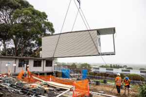 Demountable classrooms are transported from St Patrick's College Sutherland to flood-affected Trinity Catholic College Lismore.