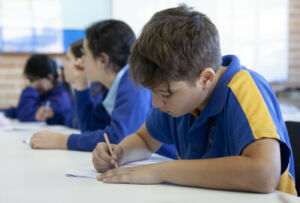 A Sydney Catholic Schools student working on a maths problem in class
