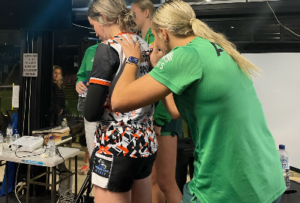 Samara Leven gets her shirt signed by rugby international Maddison Levi