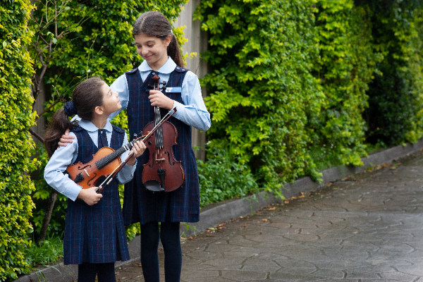 Amadeus Music Education Program students Olivia and Serena from St John Vianney Catholic Primary School Greenacre