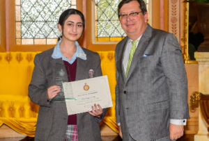 Sydney Catholic Schools' student Kardina Batti receives an award from The Honourable Andrew Bell, The Chief Justice of NSW