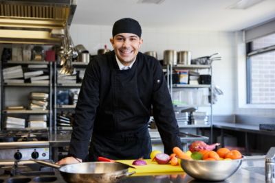 Southern Cross Catholic College Burwood student Demetrius Thalasselis in the colleg's hospitality and baking facilities