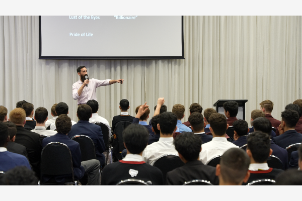 A guest speaker addresses Sydney Catholic Schools students at the inaugural 10:10 Project Conference
