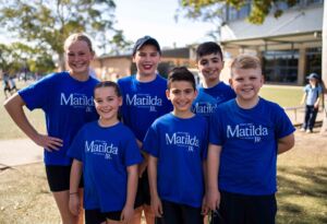 Students wear Matilda promotional t-shirts in playground after their first performance of Matilda Jnr, The Musical.