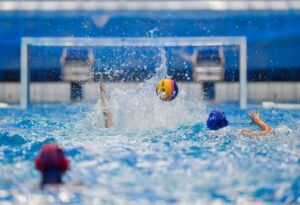 Students play water polo.