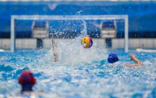 Students play water polo.