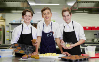Three Marist College Eastwood students showcasing their Food Technology skills