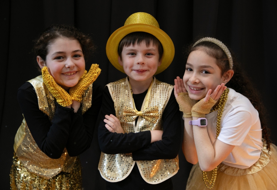 Photo of three Performing Arts students in costume