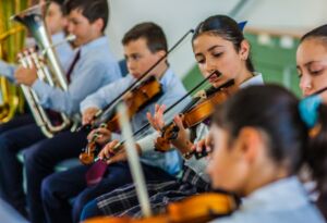 Students play the violin as part of Sydney Catholic Schools' Amadeus Music Education Program