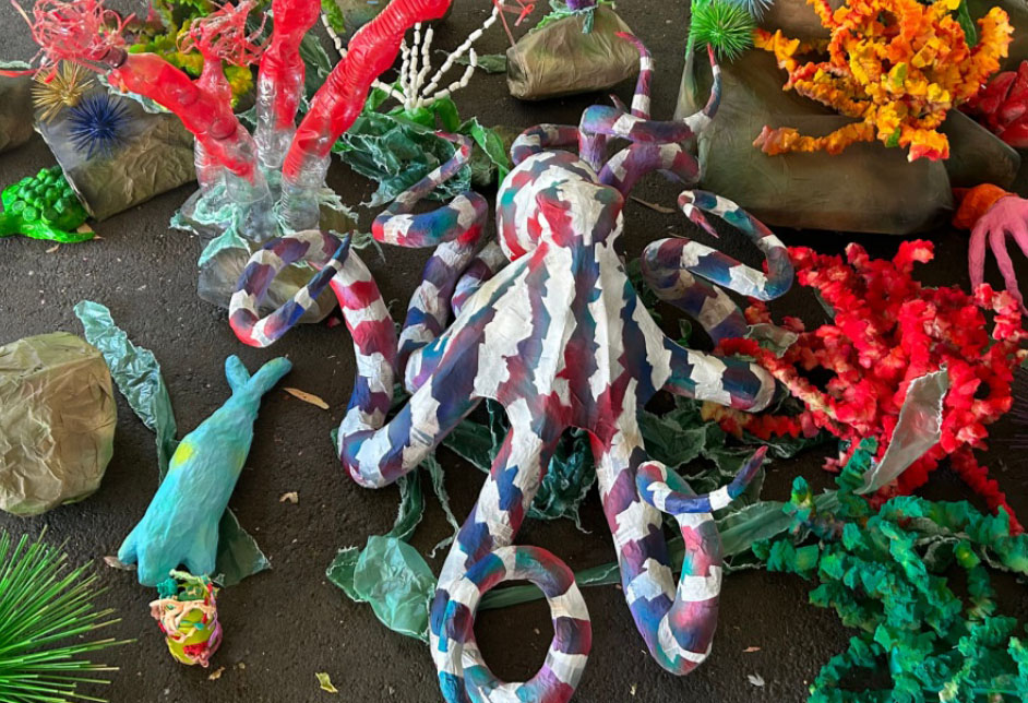Students' ocean-themed sculpture displayed on the playground
