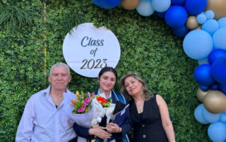 A photo of Nancy and her family at her Year 12 graduation ceremony