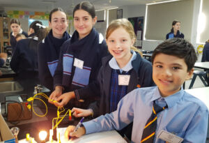 Students experiment with light in a Science lab.