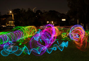 Colourful swirls of light in the school oval from Domremy College Five Dock's Festival of Light.