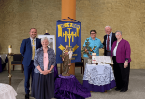 Photo showing Patrick Morrison, Principal of St Catherine Labouré Gymea with The Sisters of St Joseph of orange during their visit to his school