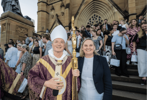 Photo showing Archbishop Anthony Fisher and Danielle Cronin, Executive Director of Sydney Catholic Schools on the steps of St Mary's Cathedral