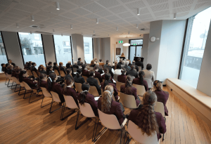 A photo of guests gathered at the new Lumos Centre for the official opening at St Clare's College Waverly