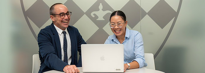 two teachers looking at a computer