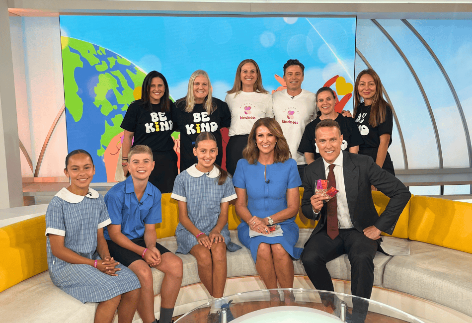 Three St Kevin’s Eastwood students with hosts Natalie Barr and Matt Shirvington, Principal Maree Simpson, James Tobin, MAOK representatives and staff in the Sunrise studio