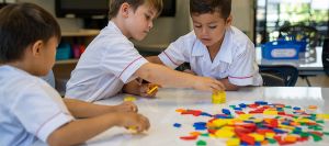 3 students learning at a table