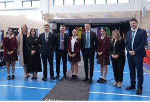 A photo of Holy Spirit Lakemba School students with Principal Kevin Griffiths, NSW Premier Chris Minns, Minister for Industrial Relations, Sophie Cotsis and school team members