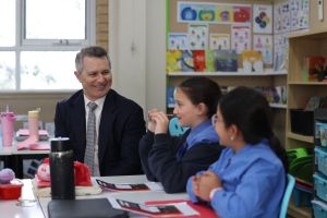 A photo showing Minister for Education Jason Clare interacting with happy students St Luke’s Catholic Primary School Revesby